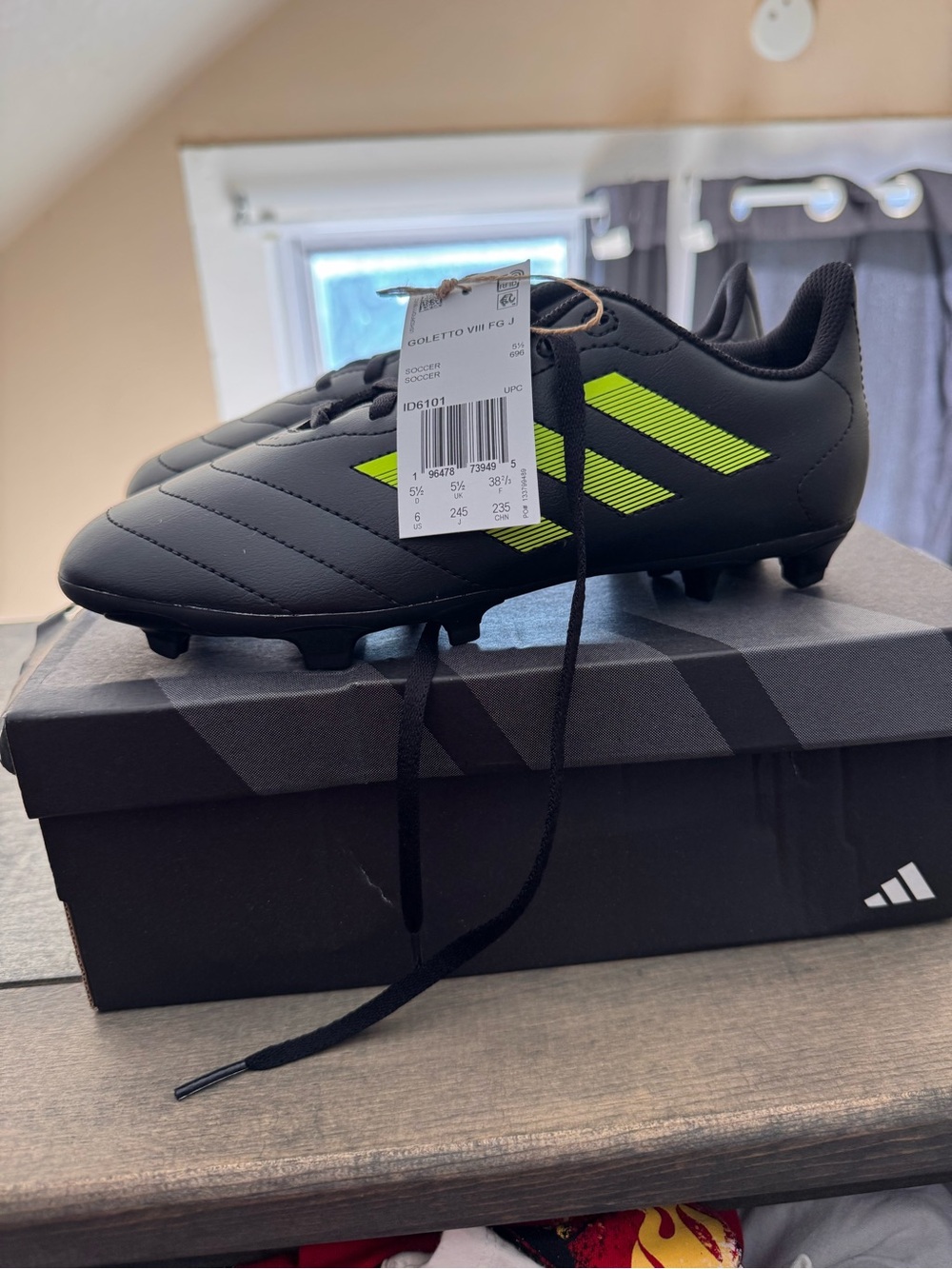 Adidas Kids' Black Soccer Cleats with Neon Yellow Stripes
